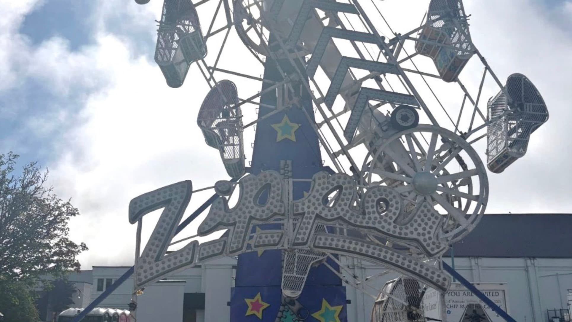 Front viewpoint of the Zipper ride behind middle operator section.