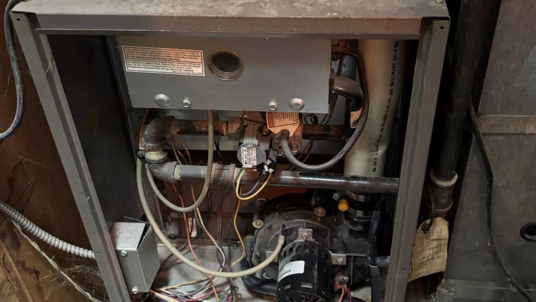 Gas furnace with upper cover removed as found after incident