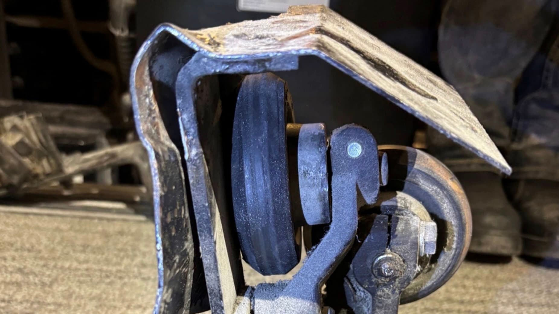 View of the damaged counterweight guide assembly.