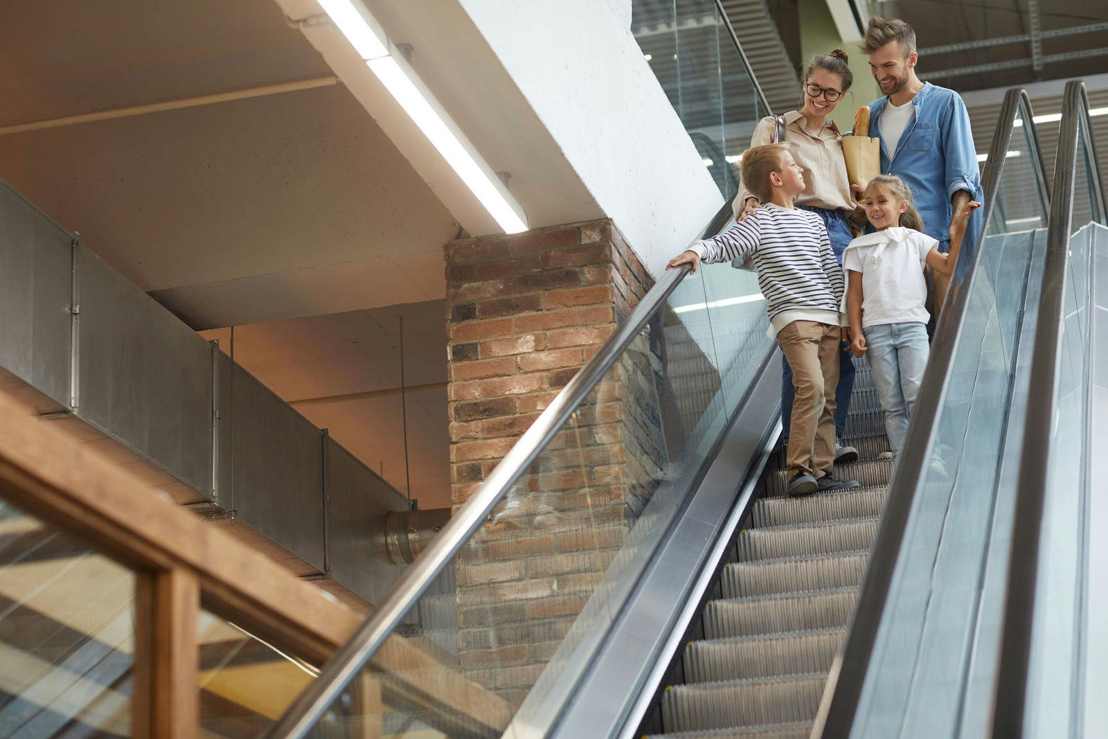 family-using-escalator.jpg