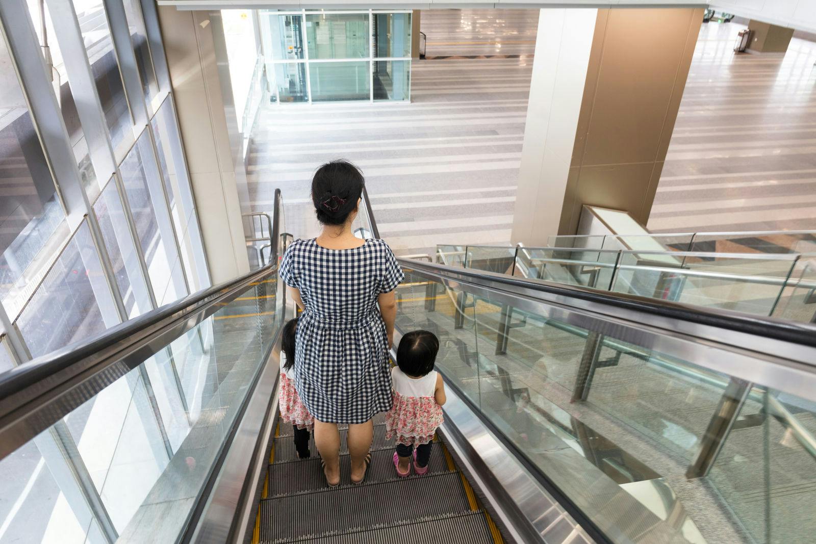 mom-kids-using-escalator.jpg